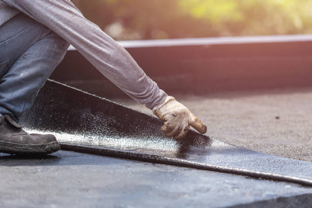 Professional Basement Waterproofing technician working in Russellville, AL